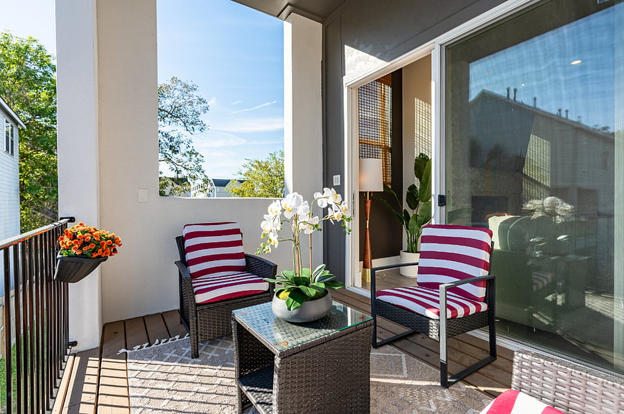 Enjoy a relaxing evening on the balcony with a table and chairs.