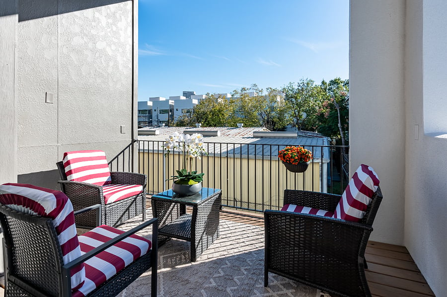 Enjoy a relaxing evening on the balcony with a table and chairs.
