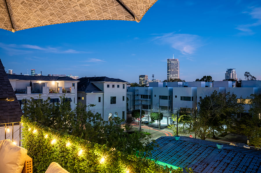 The rooftop deck has a beautiful view of the city skyline. 