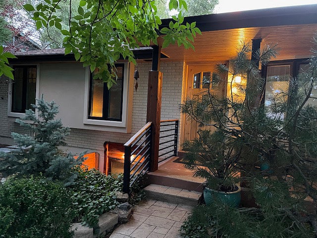 Front of home w/ lower left egress quest bedroom window