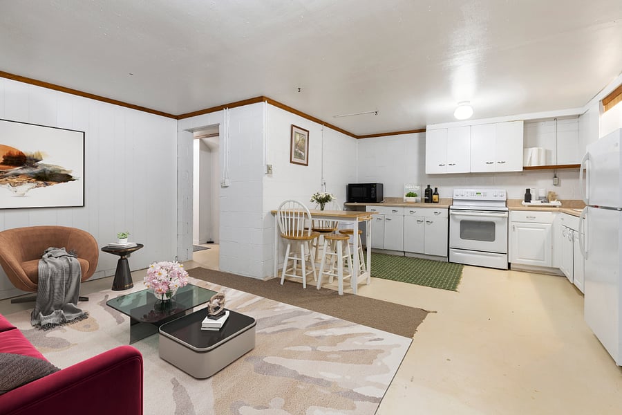SPACIOUS LIVING ROOM WITH OPEN KITCHEN.