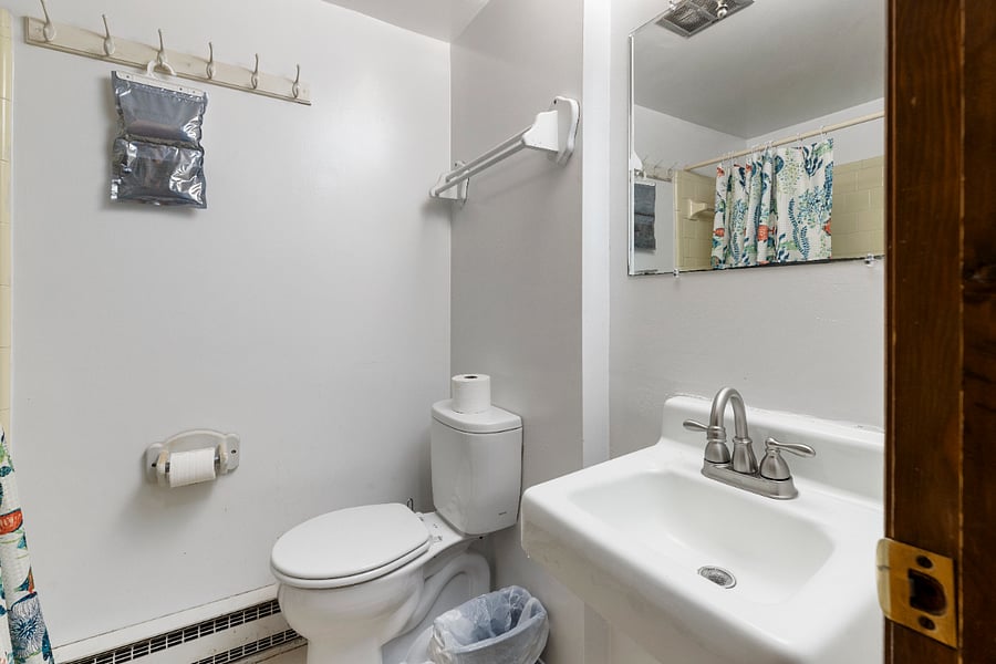 HALL FULL BATH WITH SHOWER AND TUB.