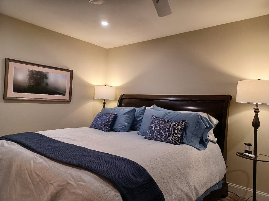 King bed in back bedroom. Large dresser and closet