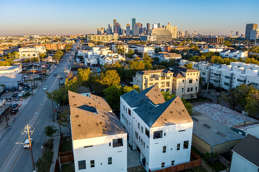 An aerial view of a city with view of Houston downtown skyline.