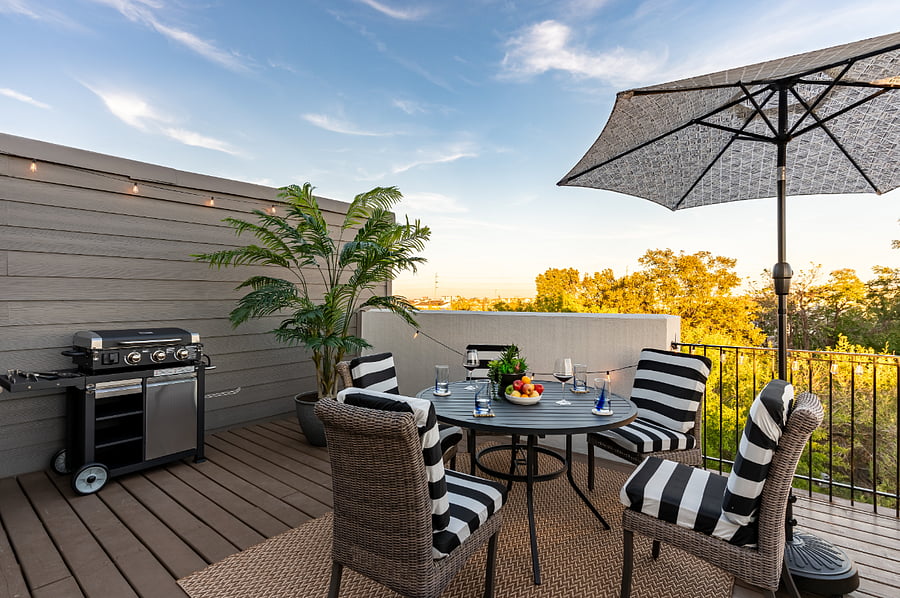 Enjoy a relaxing evening on the private rooftop with a grill, seating area and ambient lighting 