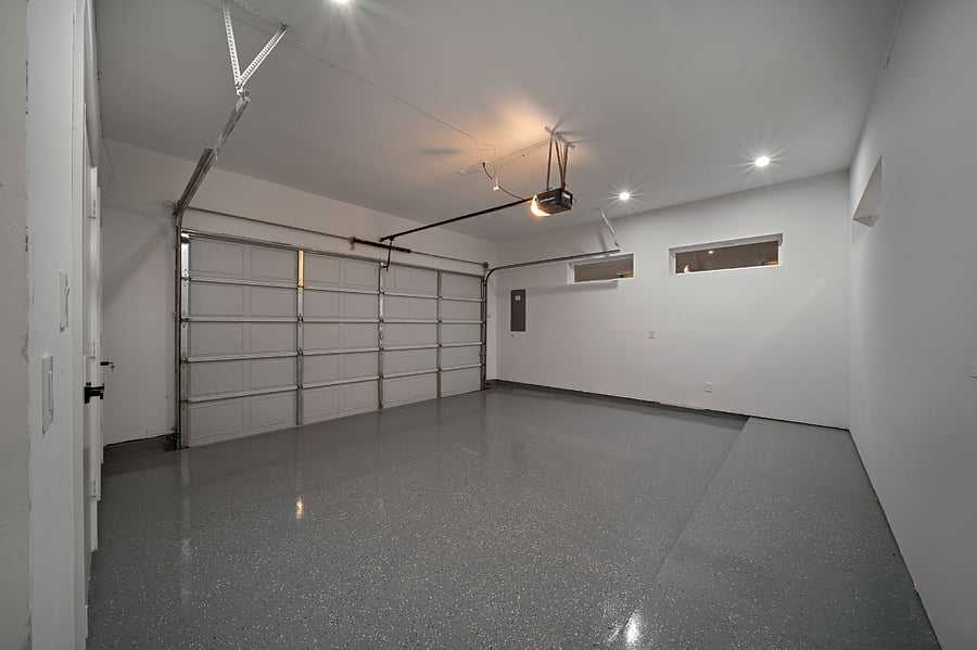 Enjoy a secure and well-lit garage. Has plenty of storage space
