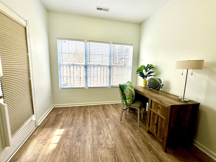 Huge office/bonus space past the dining room. Door opens to large, fully fenced outdoor area with seating for four, garden space and storage shed. 