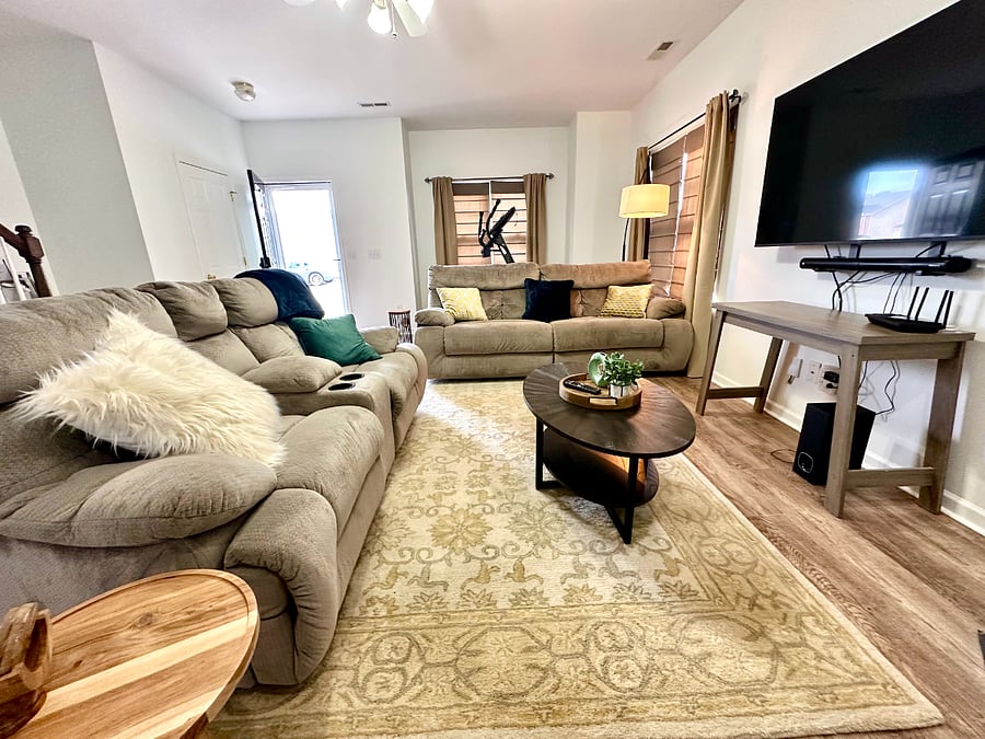 Huge living room with recliners for six people! Sooo comfortable after a long day. End unit has two sides of windows to make it light and bright. New streaming LG TV. Spectrum high speed internet provided.