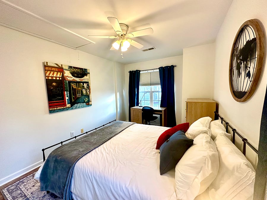 Second bedroom is also light and bright and inviting as it has windows on two sides. Bed is a queen size.