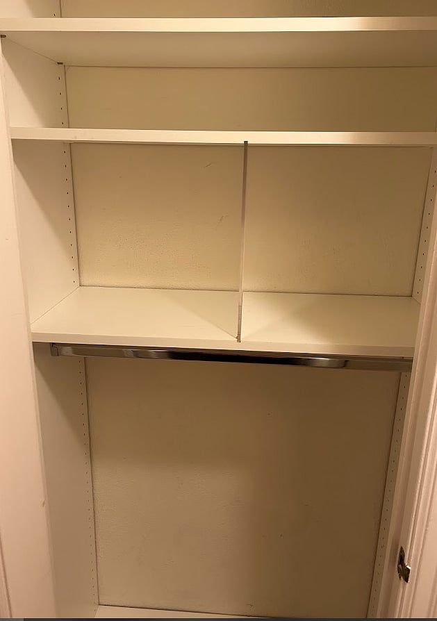Second of Two hallway closets with built-ins for quick access to linens etc