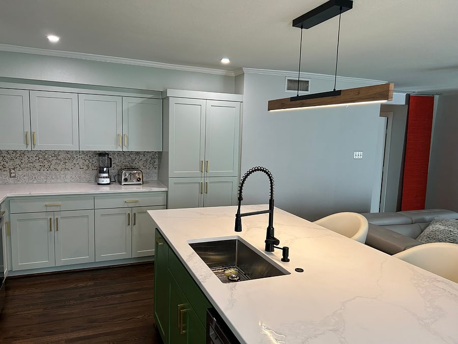 Kitchen view of island, cabinets & pantry