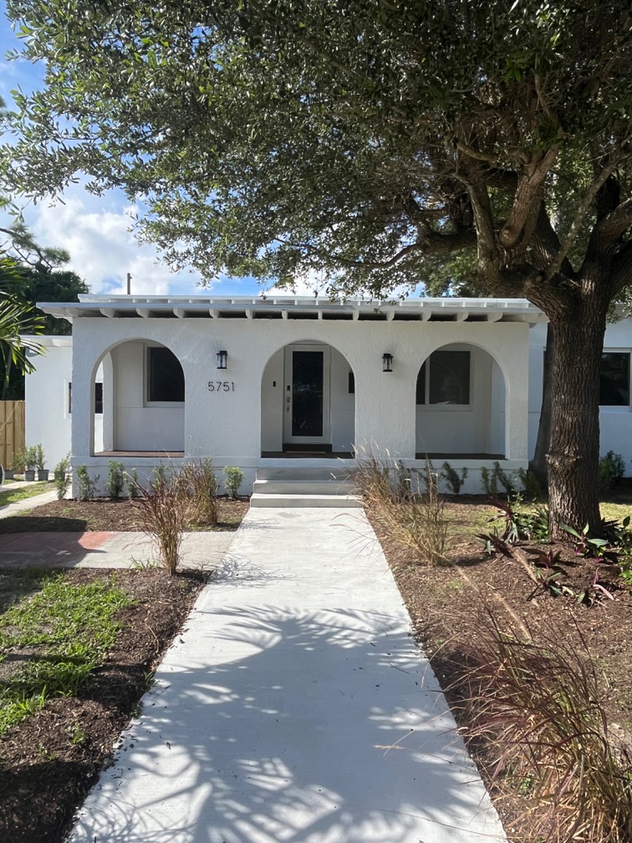 Main house with studio on left side.