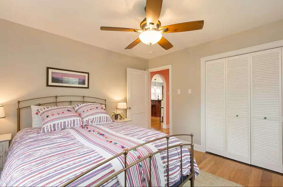 Large bedroom with queen sized bed and large closet.  