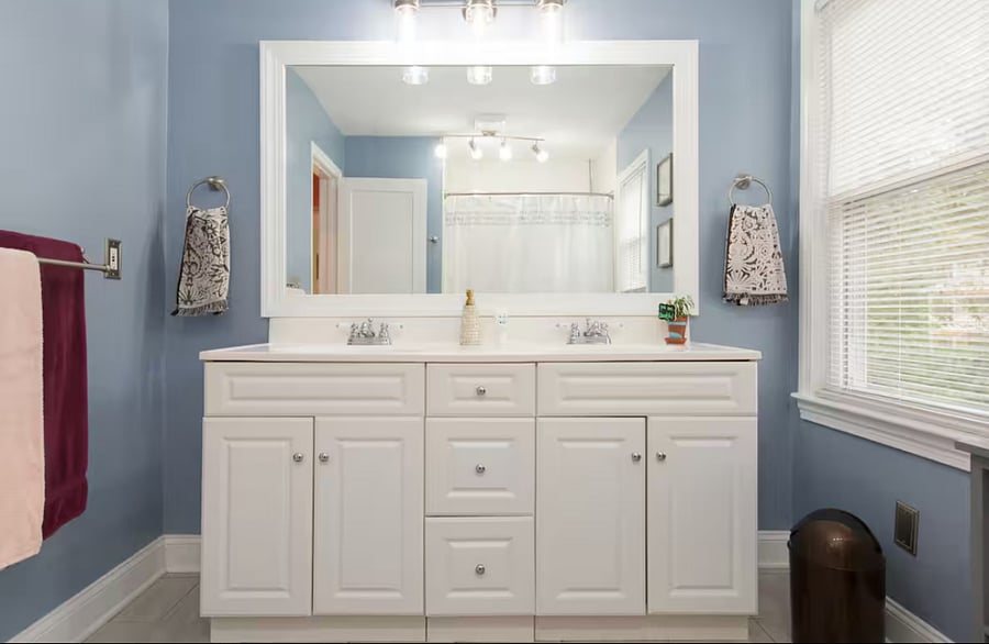 Large bathroom with double vanity sink.