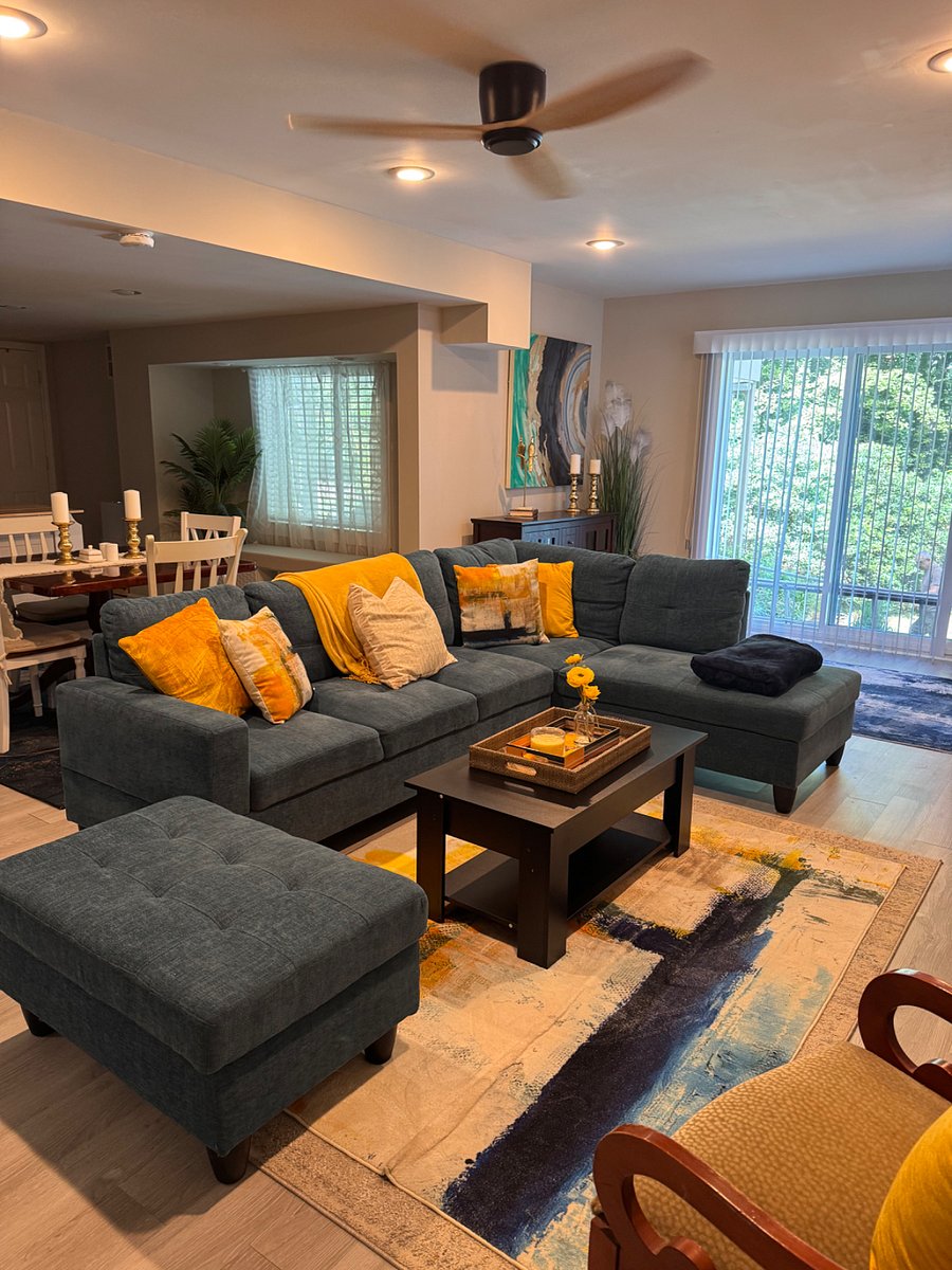 Living room with dining room and French doors to the Outdoor in the background