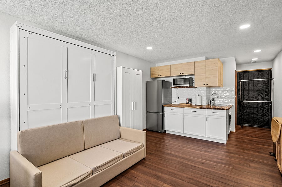 When the Murphy bed is lifted up, the mattress is completely hidden, revealing a comfortable couch and freeing up additional square footage.