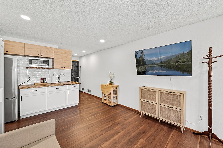 Keep your clothes and belongings organized with dedicated storage options, including a standing wardrobe, a two-level clothing rack, a cabinet under the TV, a coat hanger stand, a shoe rack by the front door, and wire shelving in the bathroom. Everything has its place for a clutter-free living experience!