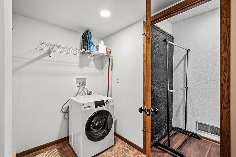 *The 2-in-1 washer and dryer takes care of everything in one cycle, so you wont need to remember to transfer your wet clothes to the dryer.
An iron, ironing board, and foldable dual-compartment hamper are available to elevate your laundry experience.

The spacious bathroom with a large shower provides the perfect retreat to help you unwind and relax after a long day of work.