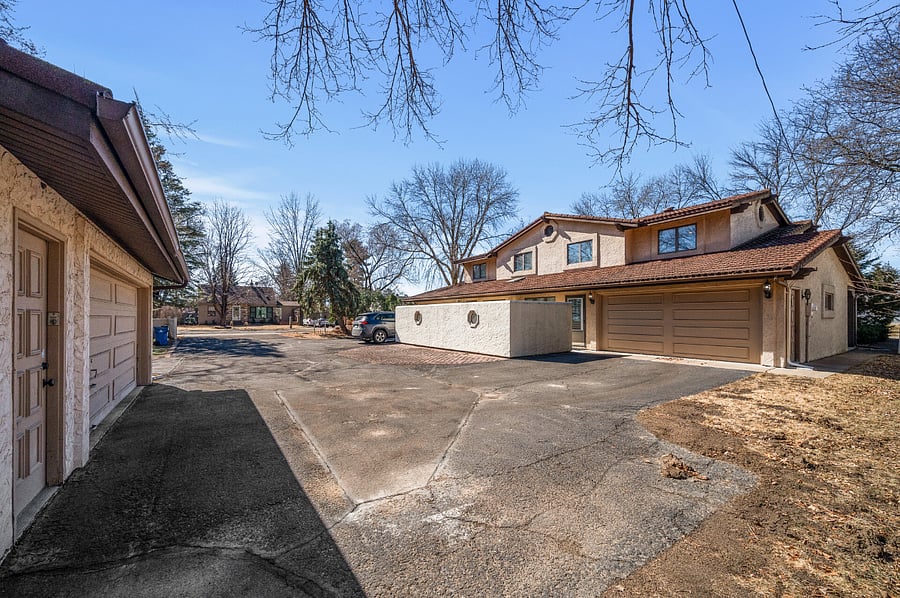 Attached 2 Car Garage, Detached 2 Care Garage, & Shared Outdoor Parking Spaces