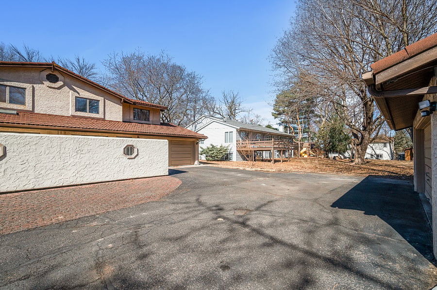 Attached 2 Car Garage, Detached 2 Care Garage, & Shared Outdoor Parking Spaces
