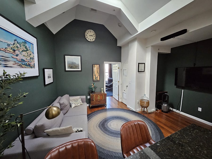 Cozy living room meets trendy bar area
