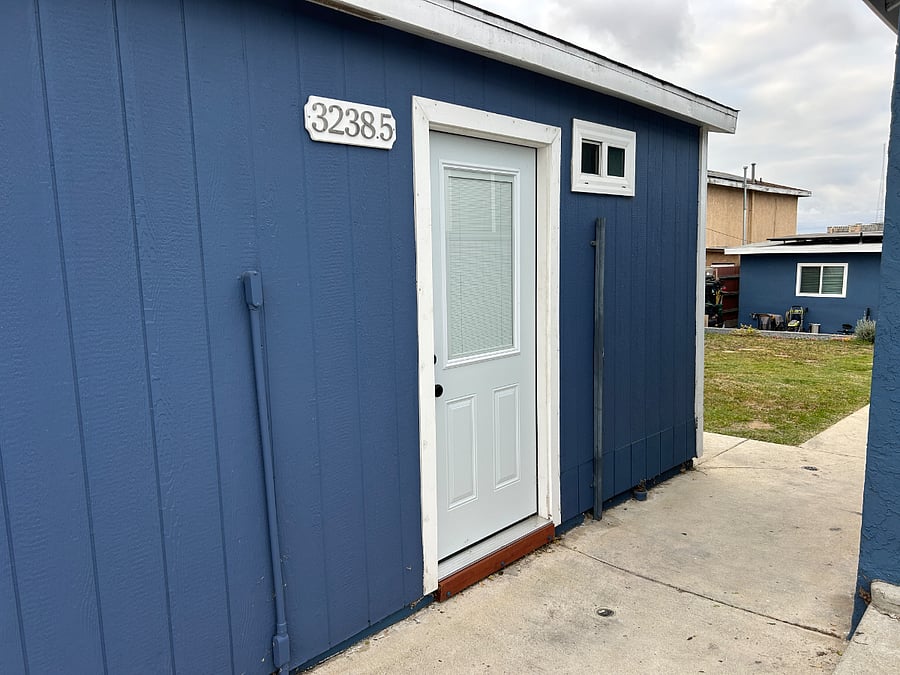 Front door and gated entry (code access) to shared courtyard.