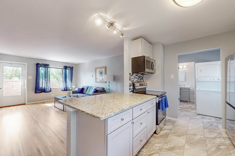 Remodeled kitchen with granite counters, tile backsplash, plenty of cabinet space, and all new appliances