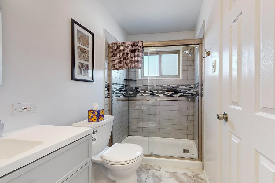 Remodeled bathroom with large walk-in shower