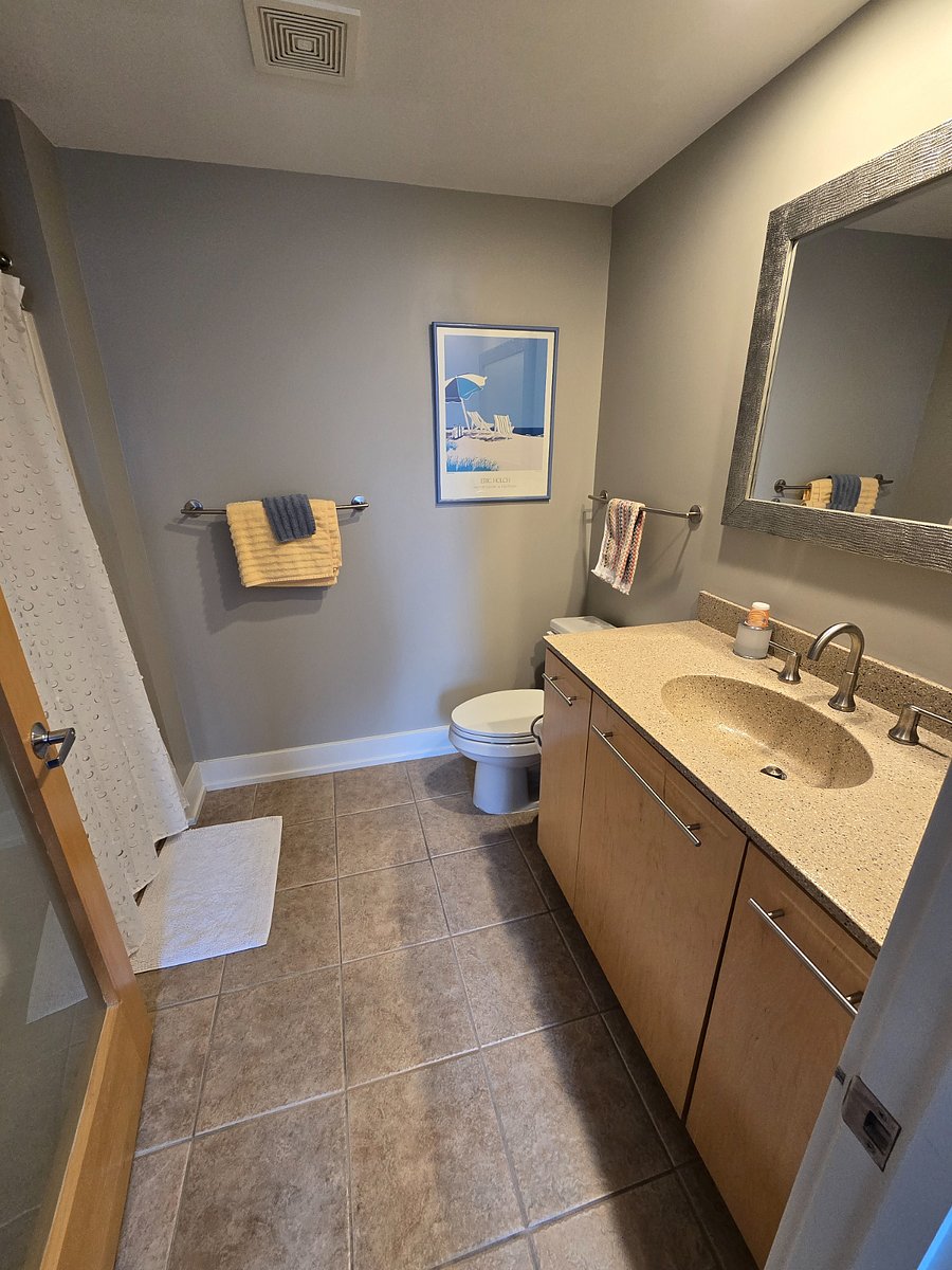Ensuite bathroom with shower, two sets of towels provided