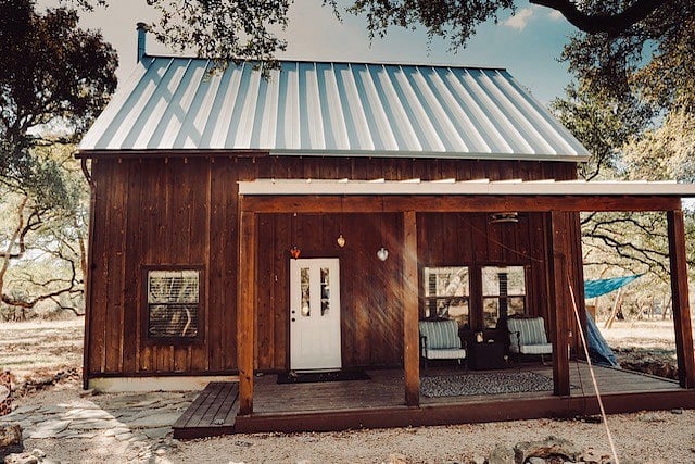 Bluebonnet entrance/porch with outside ceiling fan and sitting area