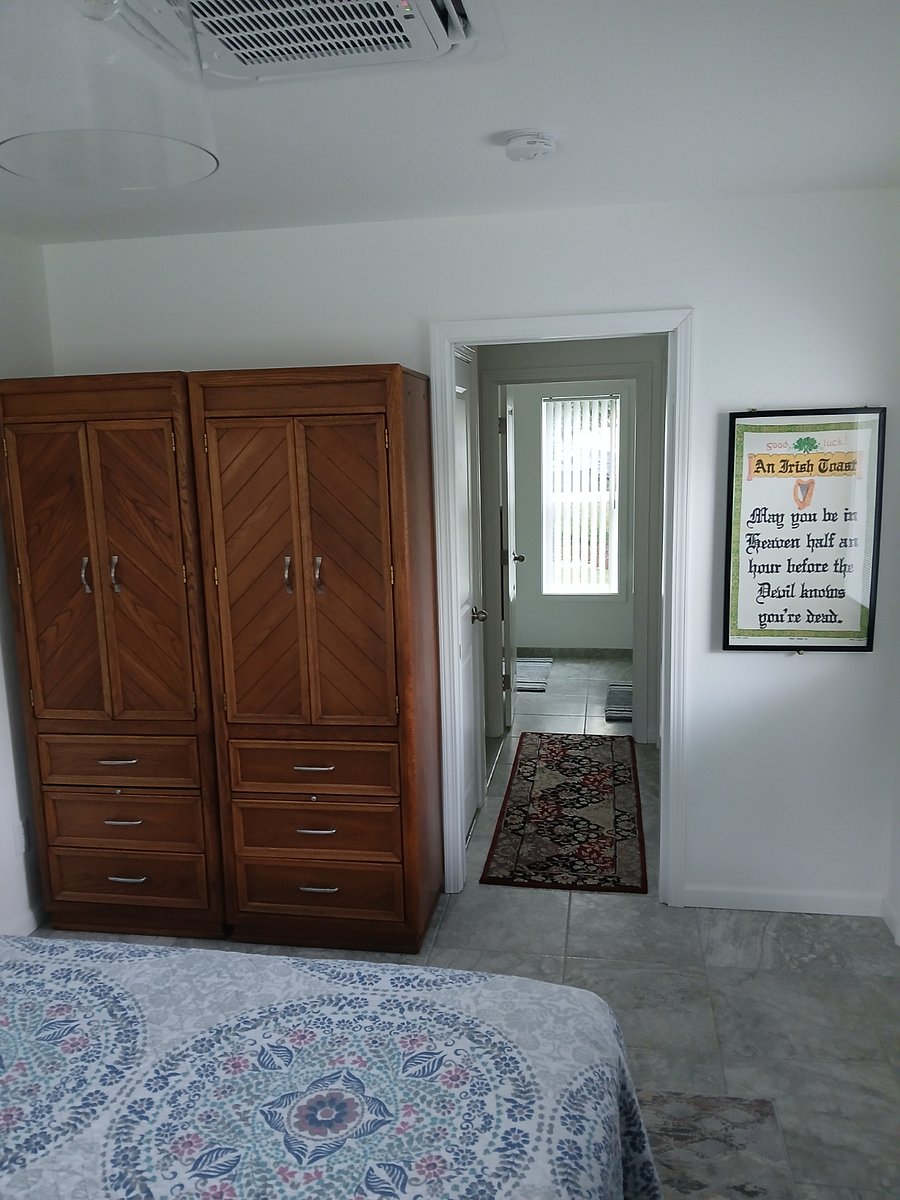 Pocket door to bedroom & small hallway to the bathroom and utility, kitchen area.