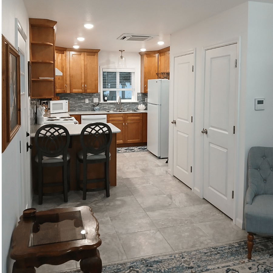 Coat closet is door nearest the thermostat and the other door is the pantry.