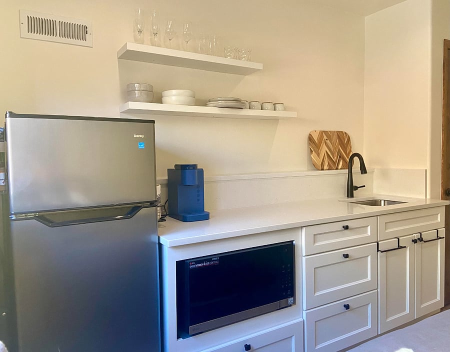 New Refrigerator/Freezer, Toaster, Microwave, Induction Plate, Coffeemaker, Quartz counters.