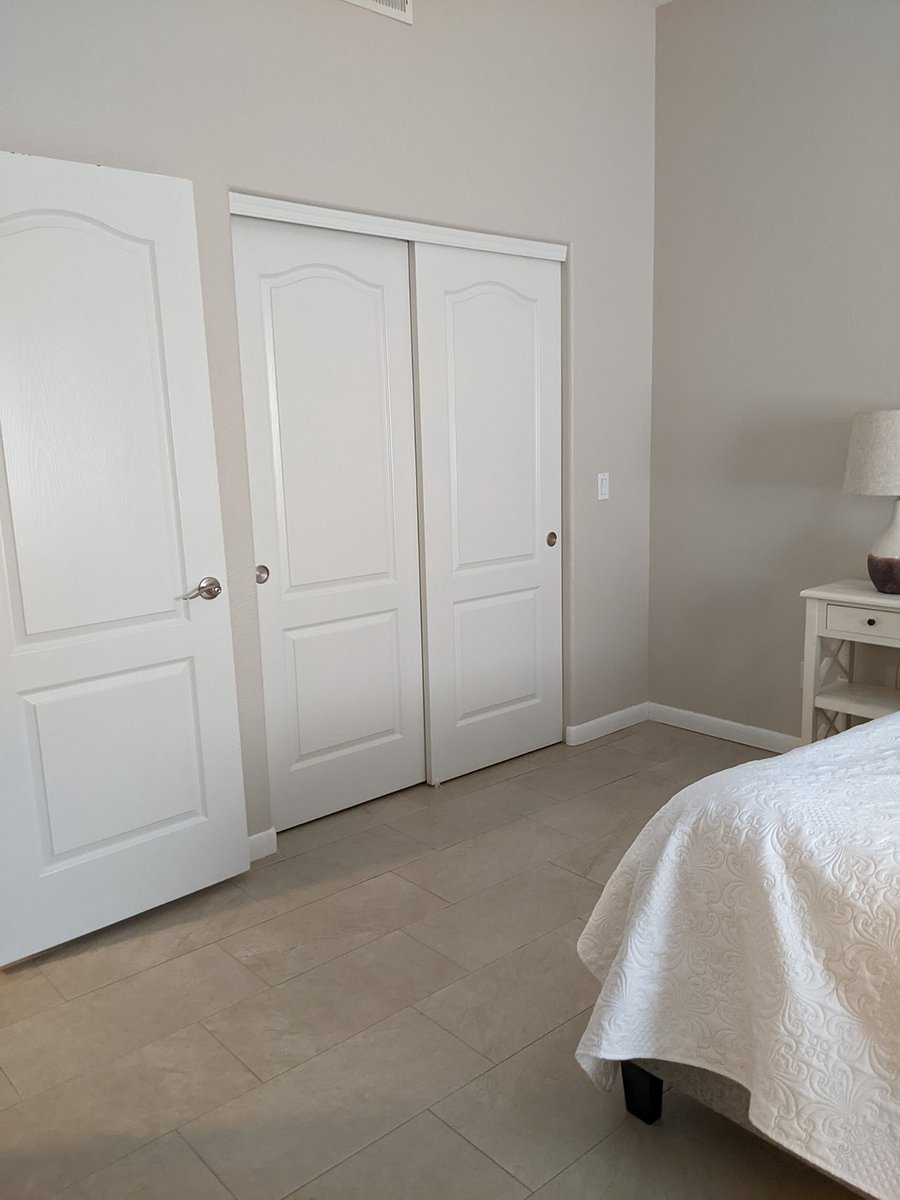 Walk-in closet in the downstairs main bedroom 