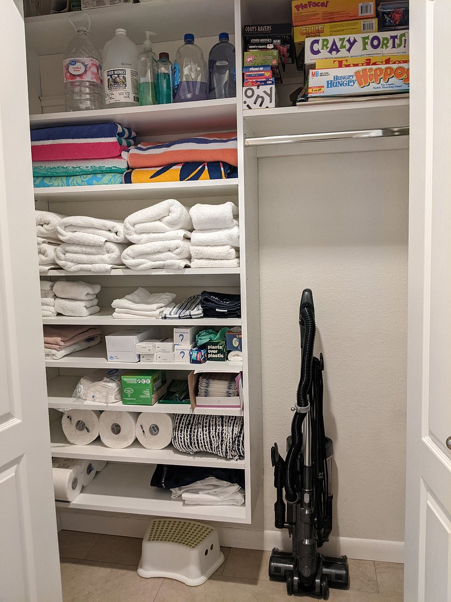 Extra towels, supplies, vacuum and cleaning supplies in downstairs hall closet
