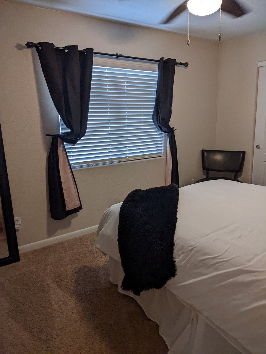 Upstairs north bedroom has a comfortable queen sized bed and a 32" Smart TV