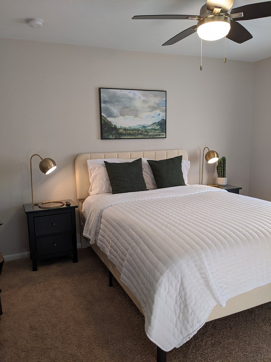 Upstairs south bedroom with comfy queen sized bed and 32" Smart TV