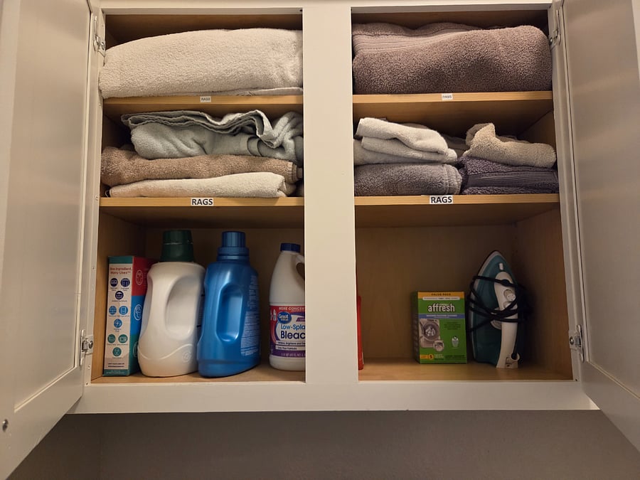 Rags for dusting or spills. Iron and ironing board.