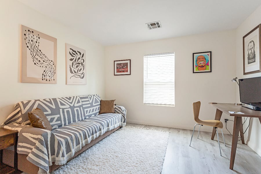 Guestroom with dedicated work space and sofa bed