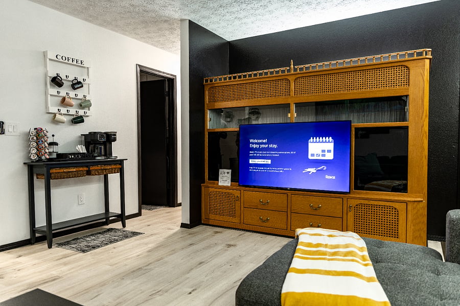 The TV pivots so. you can swivel it towards the kitchen while cooking, or the couch while lounging