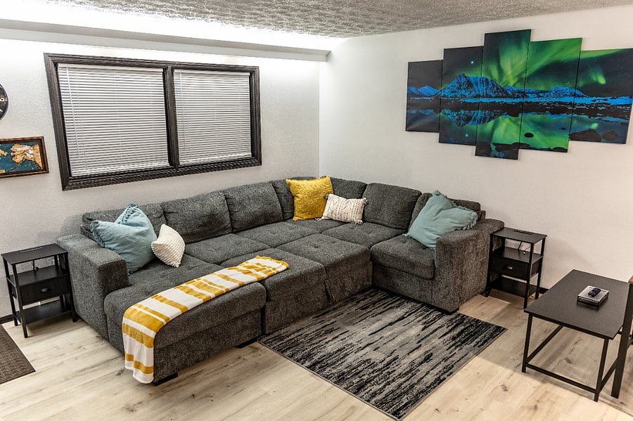 After a long work week, binge-watch your favorite show on a queen size sleeping area
