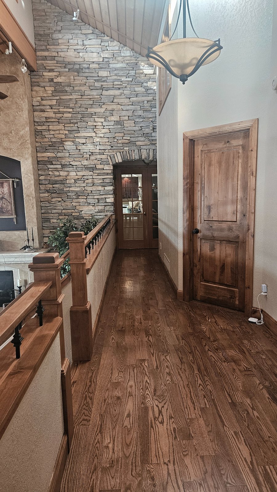 Hallway to Den/Office/Theatre Room with Overlook to Living Room