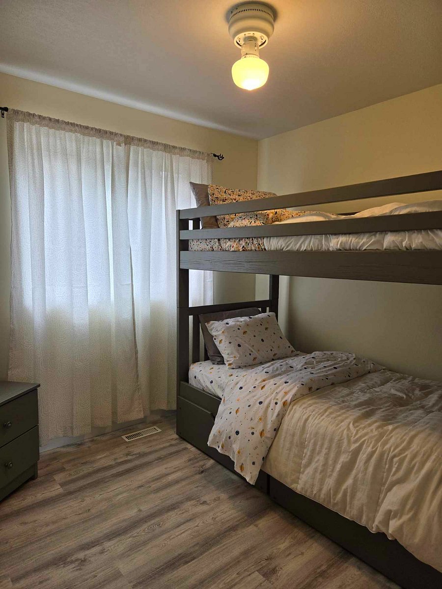 Upper level bedroom #3 with bunk beds, dresser and small closet.