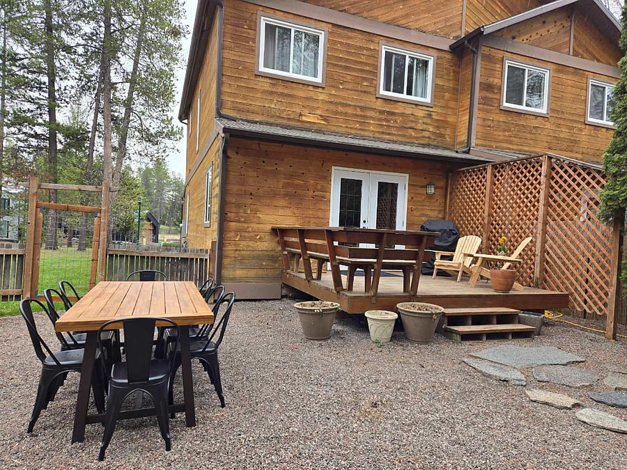 Deck area and backyard is completely fenced with pea gravely for ground cover. A gas grill and ample seating is available.