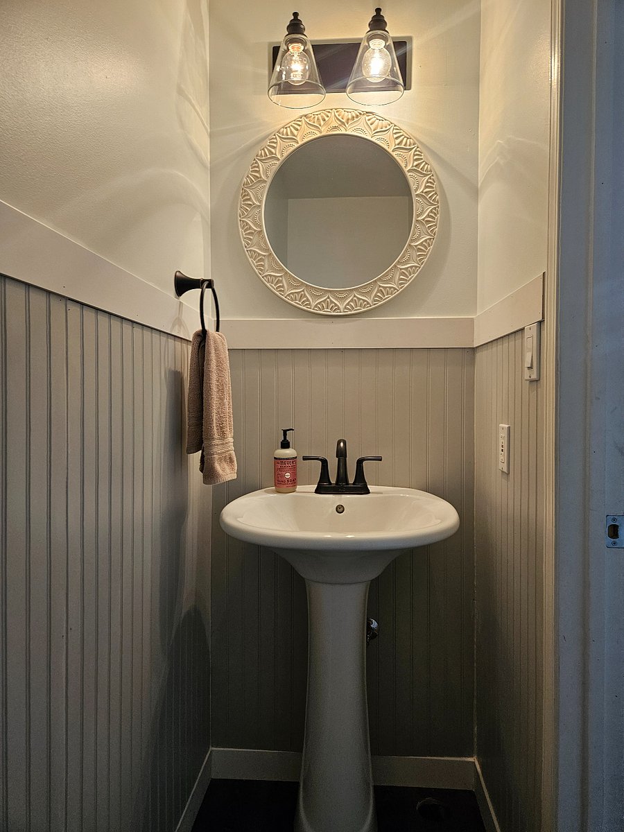 Small bathroom on the main floor, just off the kitchen.