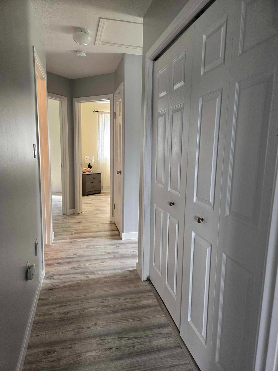 Top level hallway to the bunkbeds on the right and to the queen bed on the left.