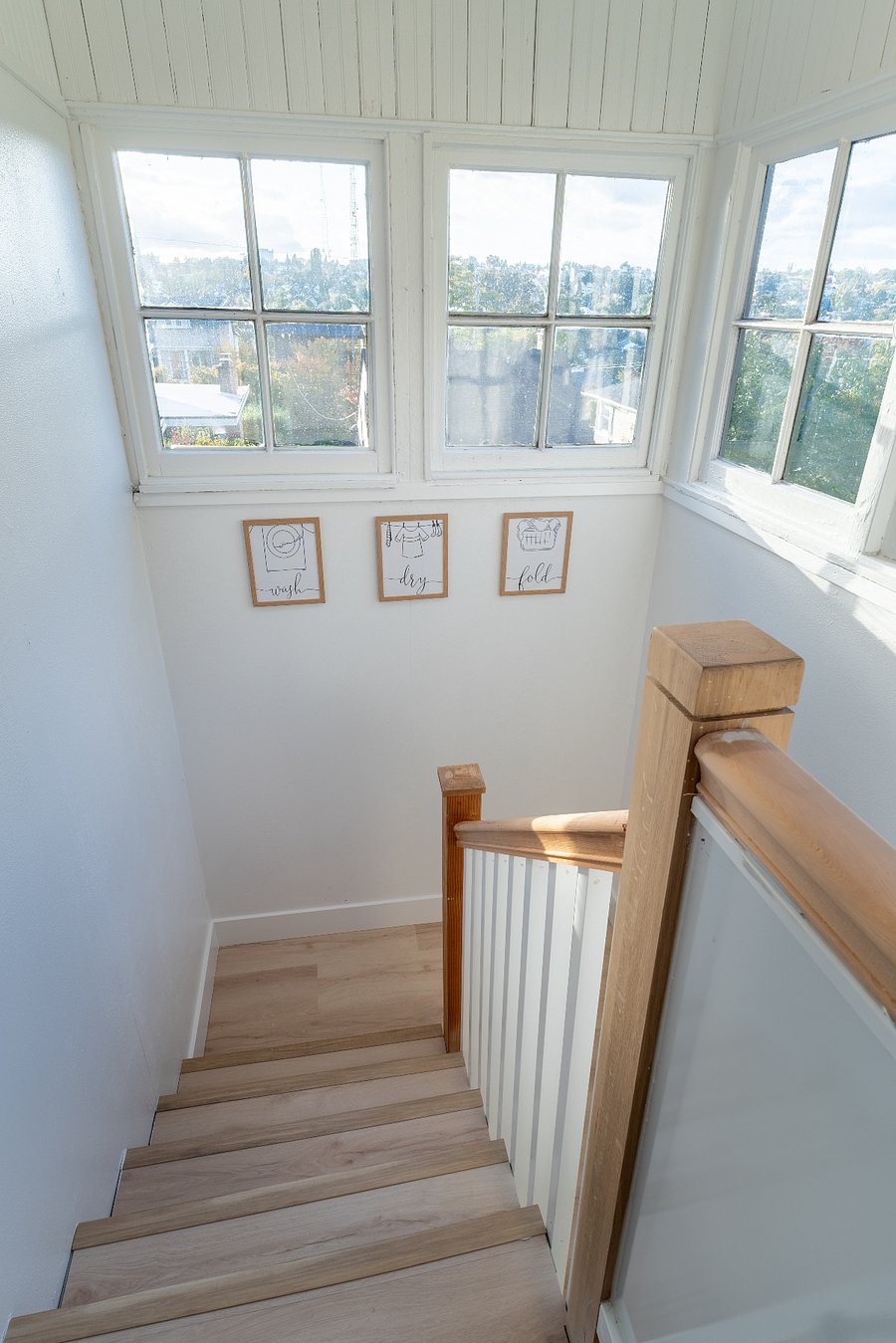 Stairs leading down to the enclosed laundry room for the unit.
