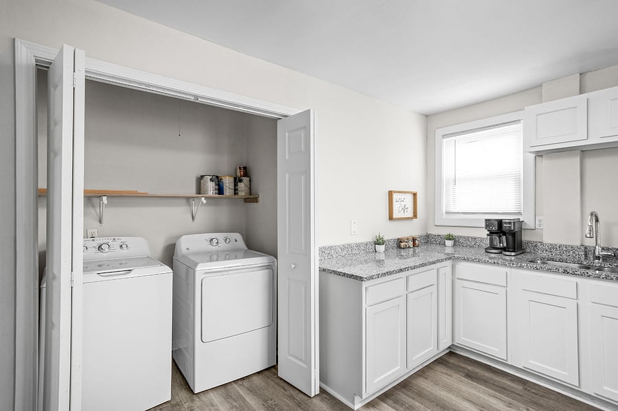 Convenience at its best a fully equipped laundry space right in the kitchen!