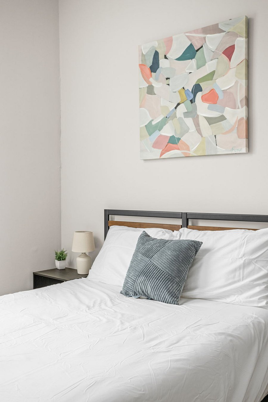 Cozy bedroom with a stylish touch and a calming color palette.