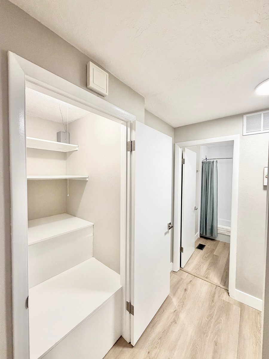 Second hall closet between living room, bedrooms and upstairs bathroom.